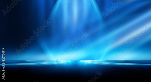 Dark empty abstract scene  rays of searchlights  neon blue light  highlights and lights. Night view of the scene  a tunnel with illumination. Dark background with spotlights.