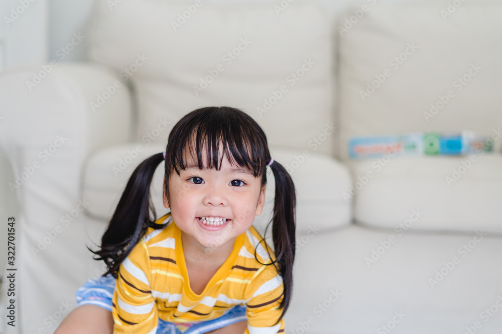 Happy Little asian toddler girl showing front teeth with big smile and laughing: Healthy happy funny smiling face young adorable lovely female kid.Joyful portrait of asian kindergarten school student. Happy Little asian toddler girl showing front teeth with big smile and laughing: Healthy happy funny smiling face young adorable lovely female kid.Joyful portrait of asian kindergarten school student.