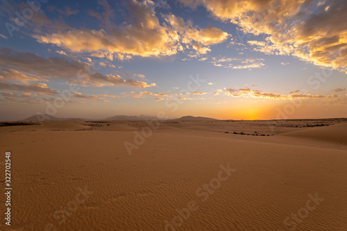 Sand dunes in the National Park of Dunas de Corralejo during a beautiful sunset  Canary Islands - Fuerteventura