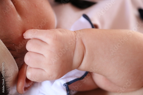 hands of mother and baby © Aphichat