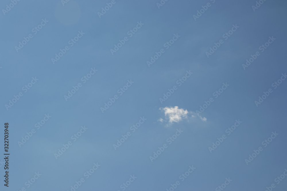 Beautiful blue sky with small white fluffy cloud, copy space, background Beautiful blue sky with small white fluffy cloud, copy space, background