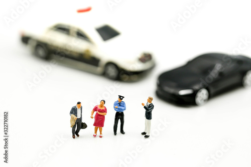 Miniature people : Police officer emergency service car driving street,car crash accident damaged