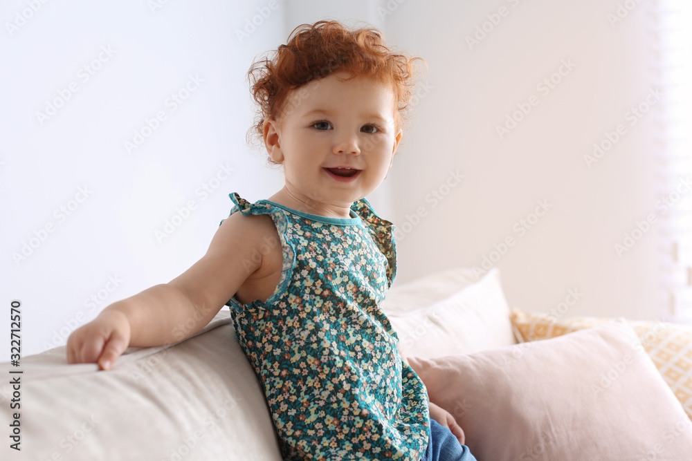 Portrait of cute little child on sofa at home Portrait of cute little child on sofa at home