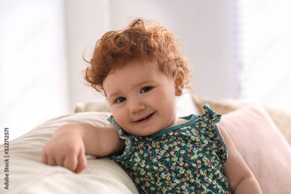 Portrait of cute little child on sofa at home Portrait of cute little child on sofa at home