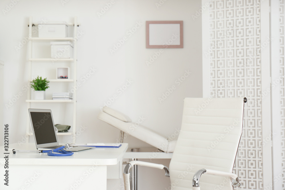 Doctor's workplace with modern laptop in medical office Doctor's workplace with modern laptop in medical office