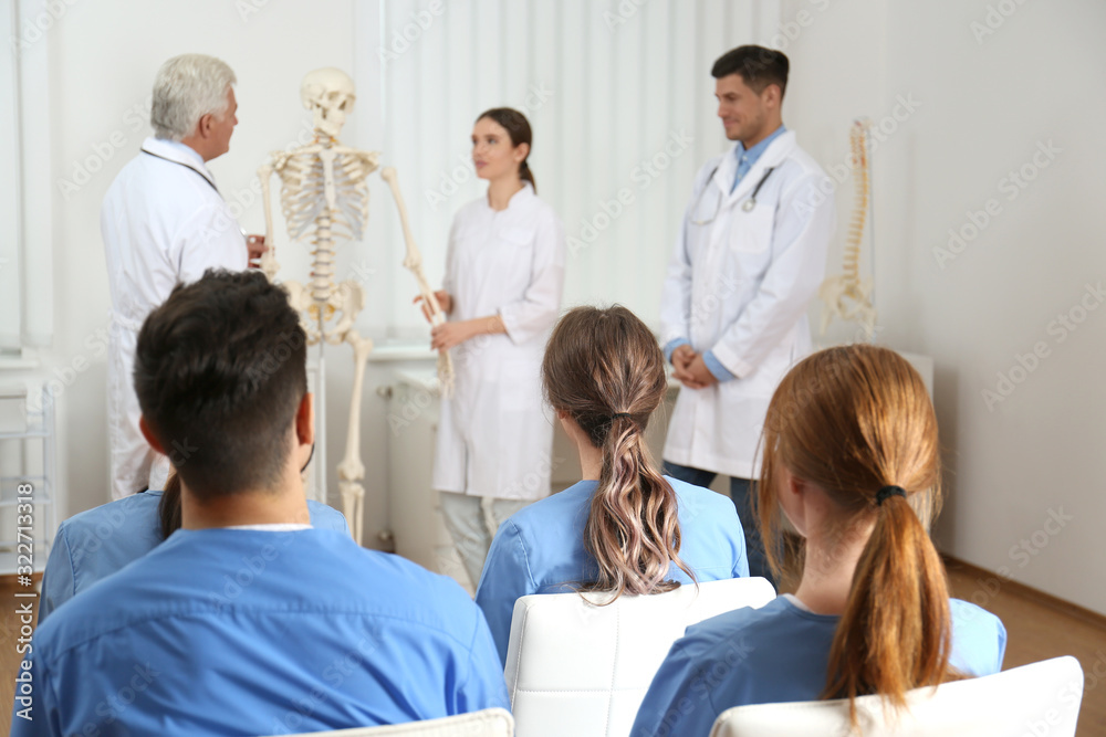 Medical students having lecture in orthopedics at clinic Medical students having lecture in orthopedics at clinic