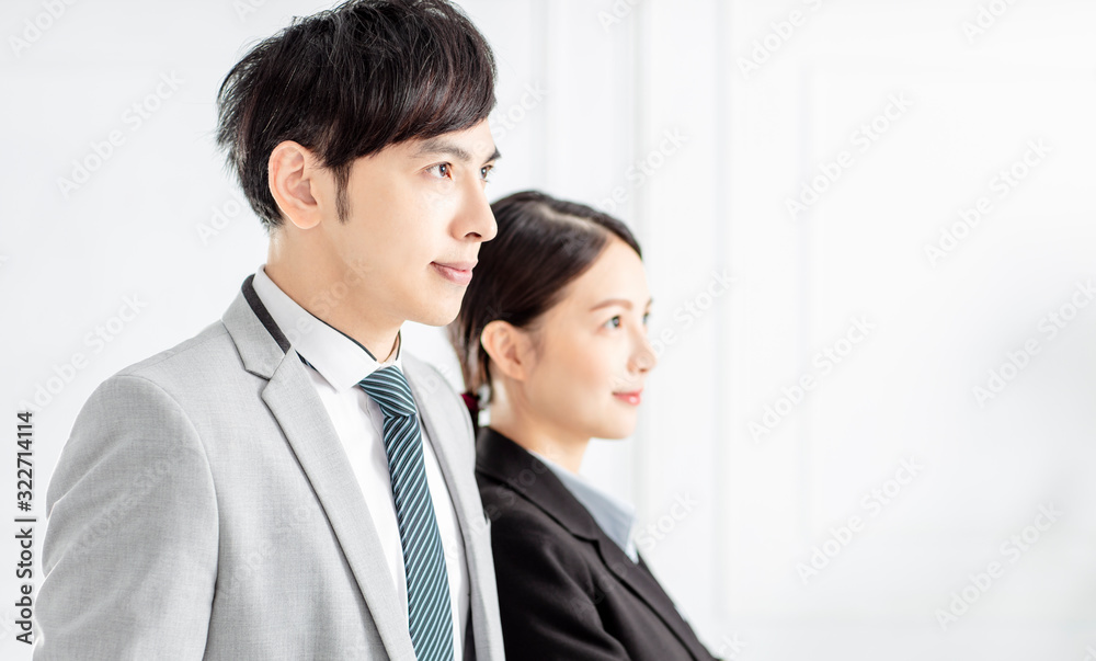 side view of Young smiling business woman and business man side view of Young smiling business woman and business man