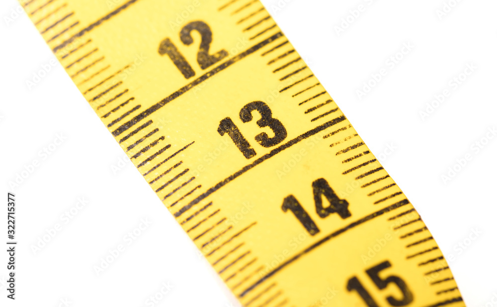 Close-up of a yellow measuring tape isolated on white - 13 Close-up of a yellow measuring tape isolated on white - 13