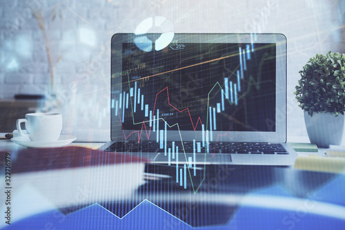 Forex market chart hologram and personal computer background. Double exposure. Concept of investment.