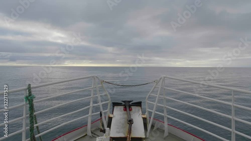 Front of the old boat Sailing in Iceland with sunset Slowmotion photo