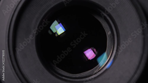 Diaphragm blades of the fixed lens opening and closing aperture f-stop adjustment of a photo camera close-up shot