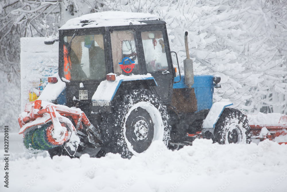 Utility equipment cleans the snow on the streets Utility equipment cleans the snow on the streets