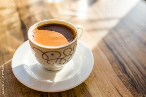 Turkish coffee on a wooden cafe table