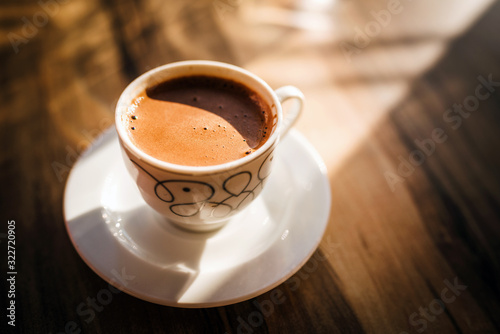 Turkish coffee on a wooden cafe table
