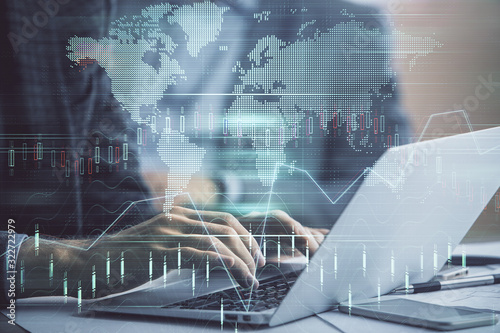 Wallpaper Mural Double exposure of market chart with man working on computer on background. Concept of financial analysis. Torontodigital.ca