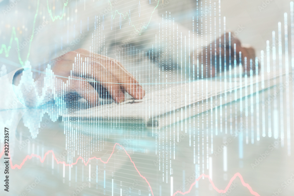 Double exposure of graph with man typing on computer in office on background. Concept of hard work. Closeup. Double exposure of graph with man typing on computer in office on background. Concept of hard work. Closeup.