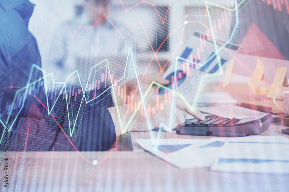 Double exposure of graph with man typing on computer in office on background. Concept of hard work. Closeup. Double exposure of graph with man typing on computer in office on background. Concept of hard work. Closeup.