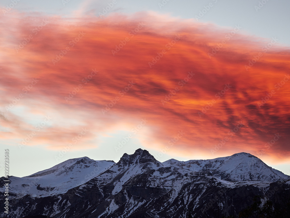 Scarlet sunset over mountains. Caucasus