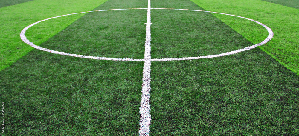 Obraz premium Detailed green soccer field grass texture