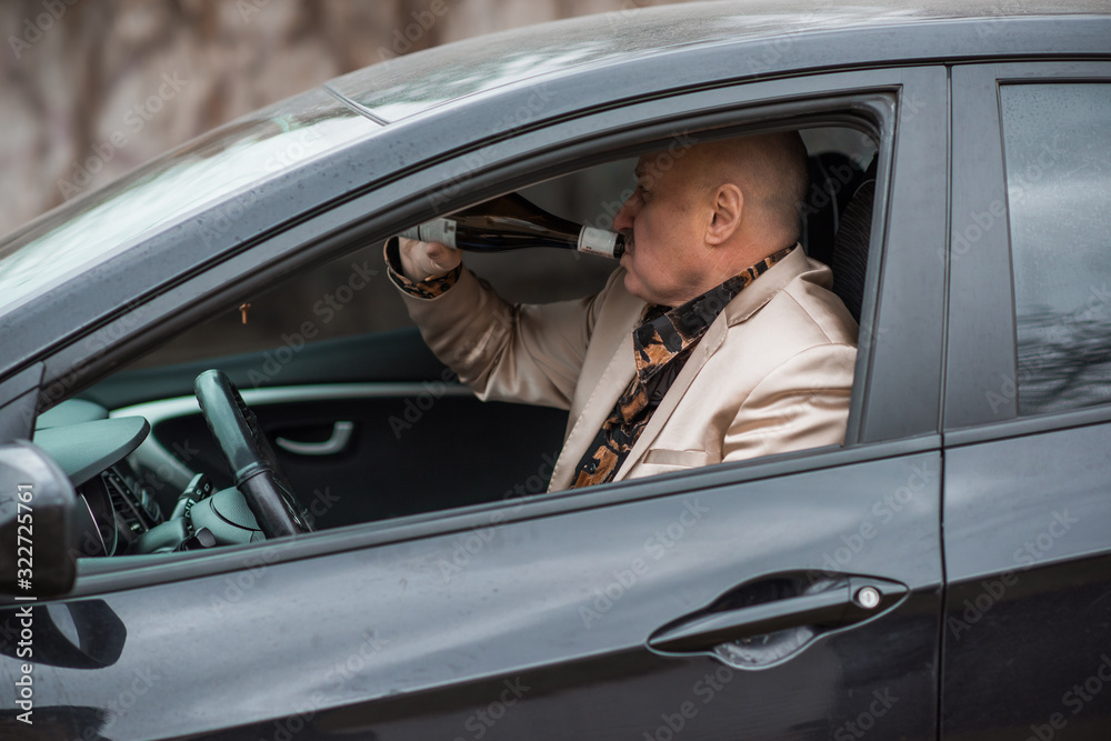 Drunk senior man in automobile. Mature older man problem, crisis lifestyle