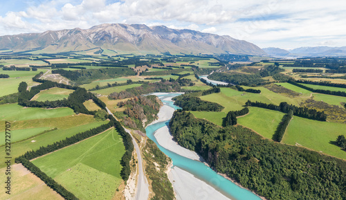 Stunning aerial high angle drone view of Rakaia Gorge Bridge and Rakaia River in inland Canterbury on New Zealand's South Island. Panning over to the mountains in the background. © Juergen Wallstabe