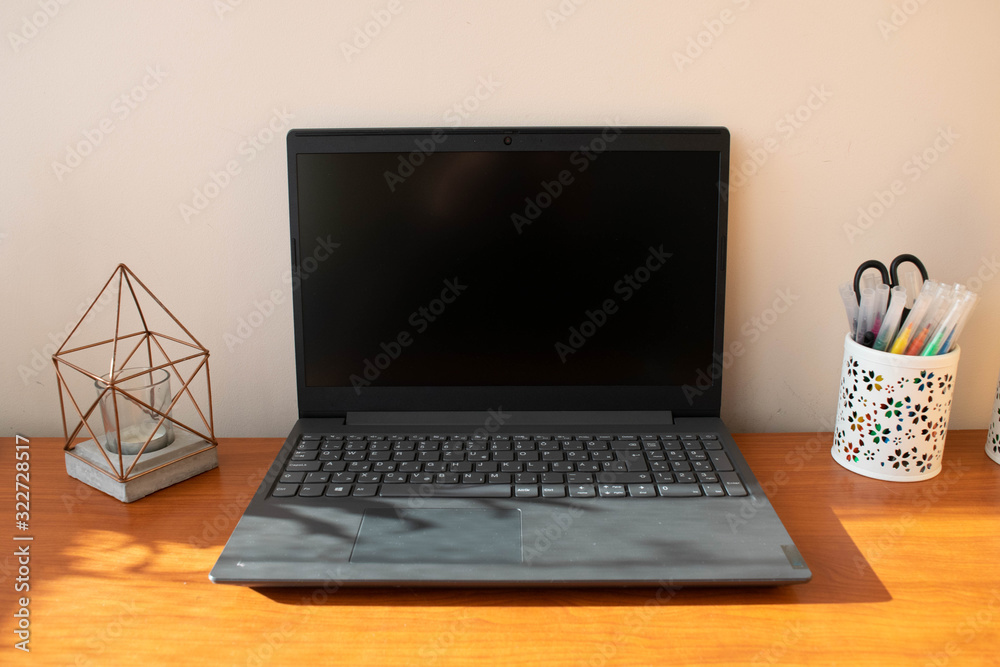Fototapeta premium Grey laptop on office desk