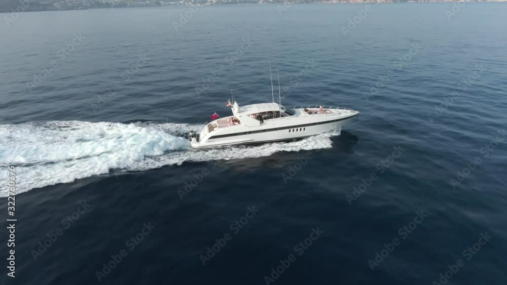 Close-Up aerial view of yacht boat floating on the ocean Close-Up aerial view of yacht boat floating on the ocean