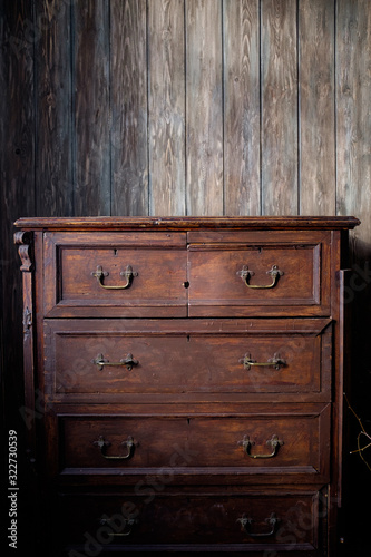 Wooden cupboard or sideboard. Old wardrobe in vintage style. Case for storing things. 