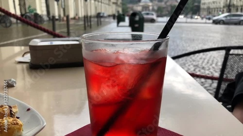 A glass with a refreshing cocktail on a bar terrace