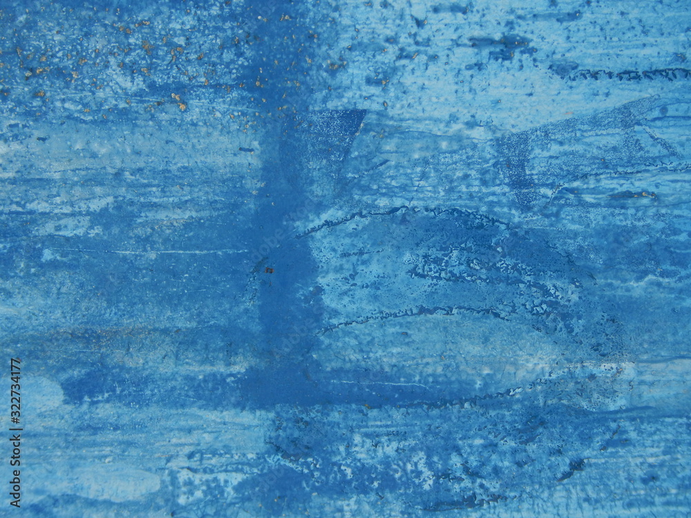 rough metal background with patchy blue color