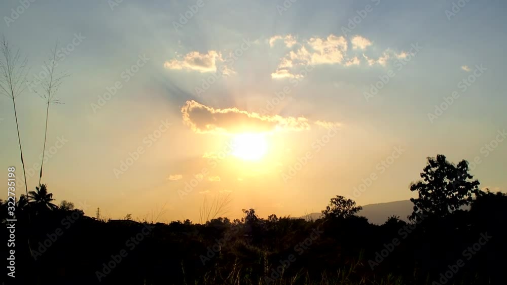 Sunset evening with beautiful colour of sun ray spread over. clouds are small but perfect shape to end a day. Background sunset Sunset evening with beautiful colour of sun ray spread over. clouds are small but perfect shape to end a day. Background sunset