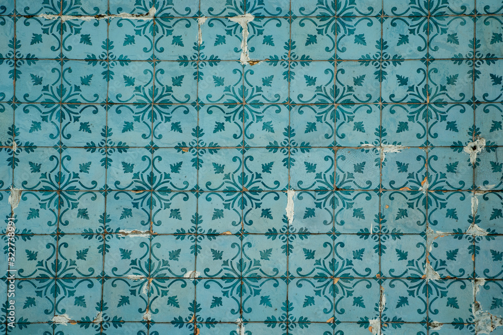 Ornate blue and teal tiles on a building in Lisbon, Portugal
