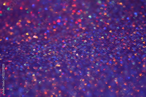 Night magic violet and purple glitter light background. Selective focus. Beautiful sparkle abstraction. Glamour Bokeh Effect. For party, holidays, celebration, Valentine's Day cards. © Elena