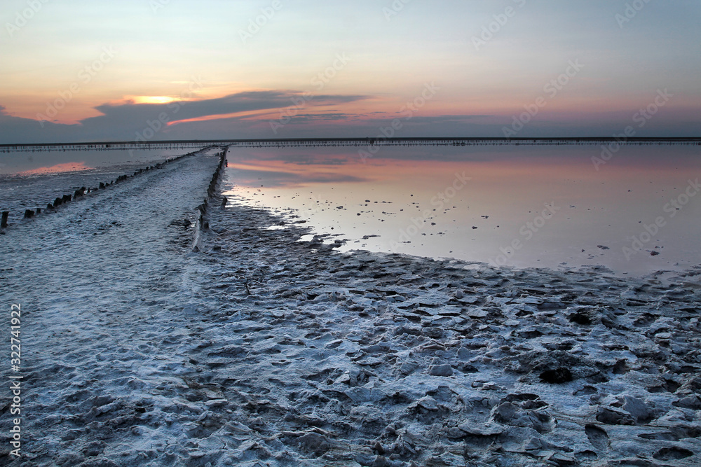 Drainage systems for open salt mining at sunset