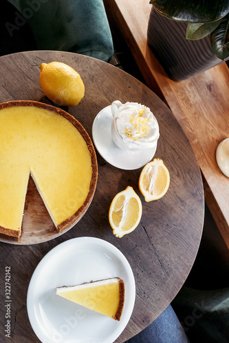 Lemon cheesecake, shop cafe, still life with coffee. Business background.