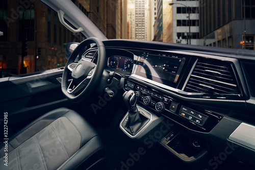 Luxury van driver seats with dashboard, multimedia control screen and steering wheel