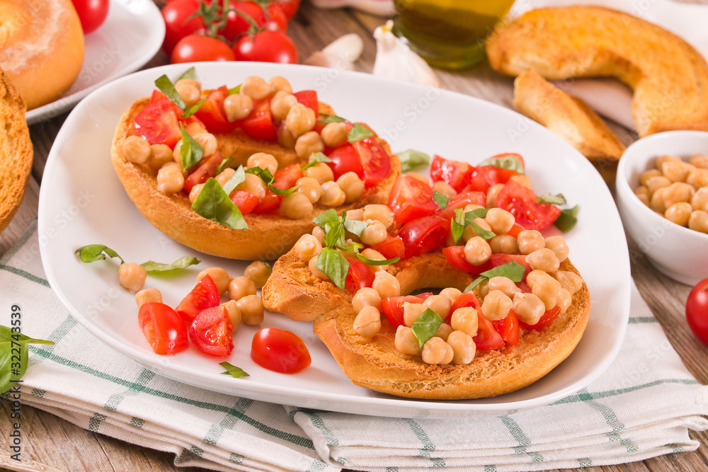 Friselle with tomatoes and chickpeas. Friselle with tomatoes and chickpeas.
