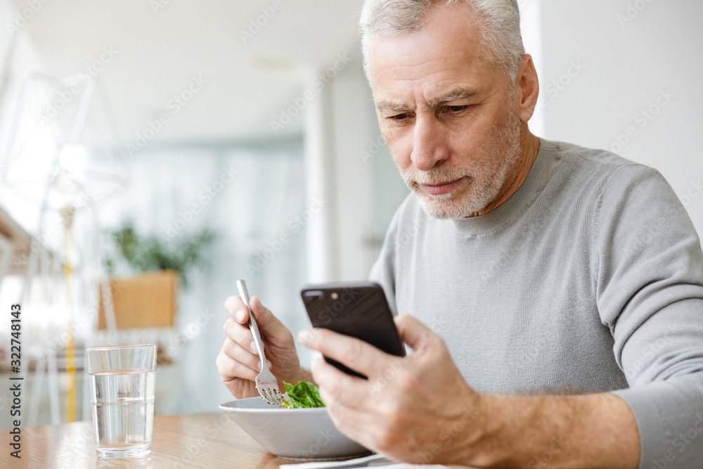 Bearded businessman sit in cafe have a dinner eat salad Bearded businessman sit in cafe have a dinner eat salad
