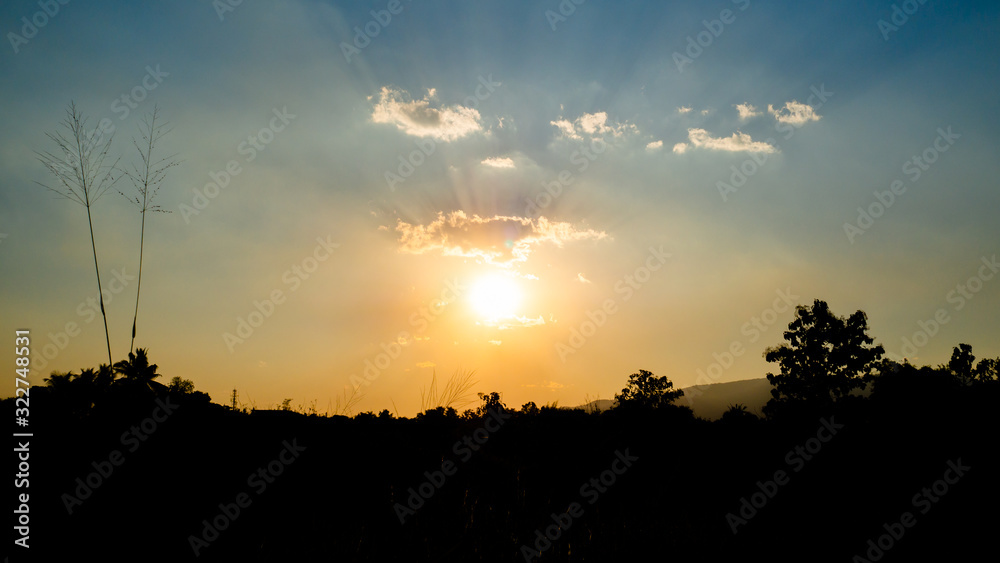 Sunset evening with beautiful colour of sun ray spread over. clouds are small but perfect in crown shape. Background sunset. Sunset evening with beautiful colour of sun ray spread over. clouds are small but perfect in crown shape. Background sunset.