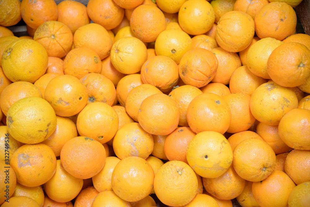 Pile of oranges, freshly produced with imperfections on the skin