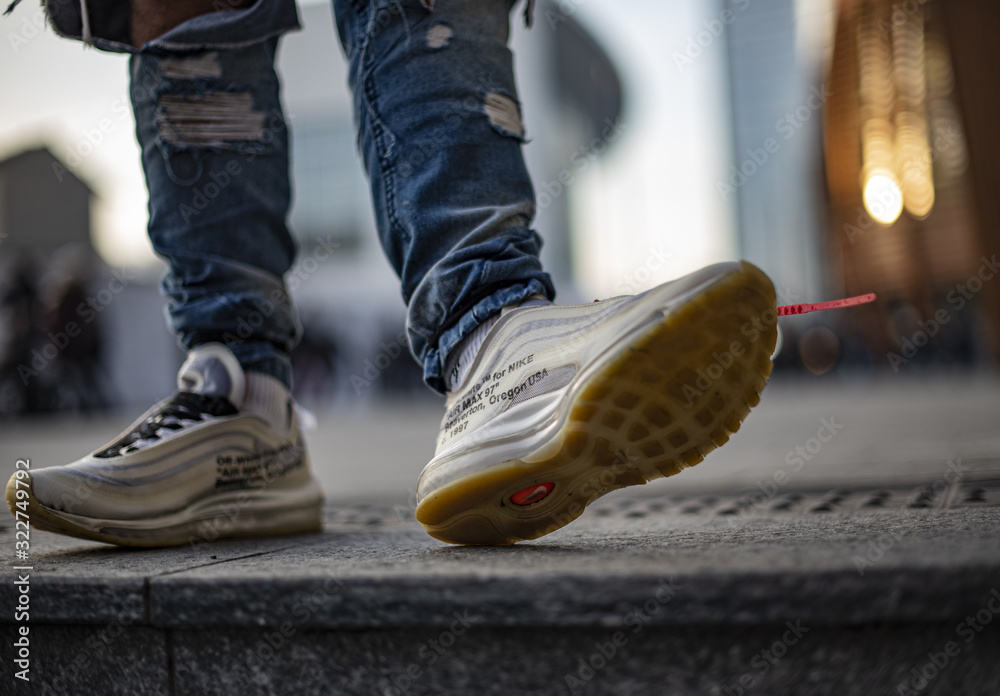Young man wearing pair of Nike Max 97 Off-White foto de Stock | Stock