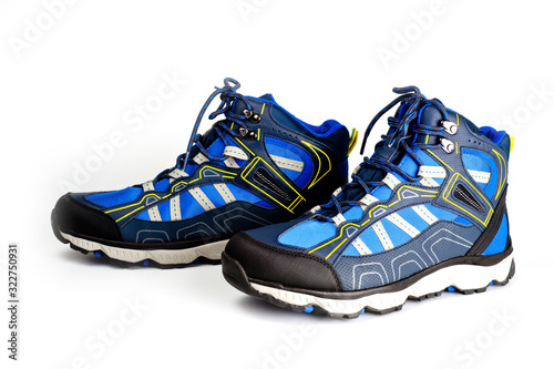 Winter, sports, waterproof men’s boots in blue. On the lacing. Sports winter shoes. Comfort and activity.
