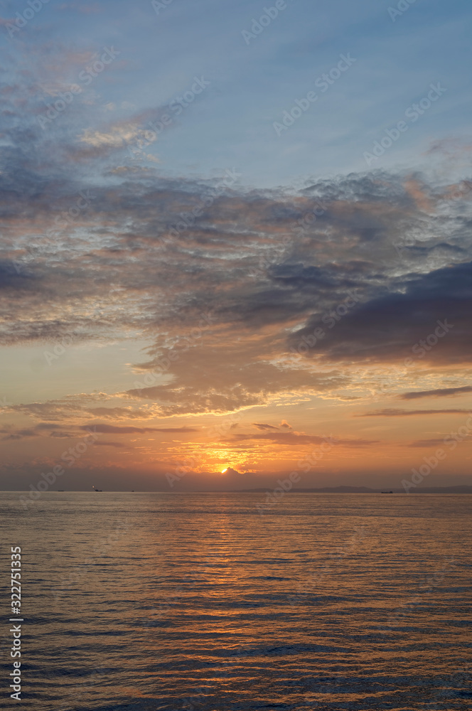 Fototapeta premium The sun rises at Dawn over an inshore Peruvian Oil Field off the North West Coast of the Country near to Talara.
