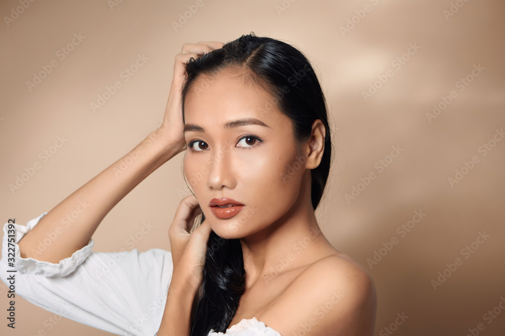 beauty headshot of sexy woman with bare shoulders