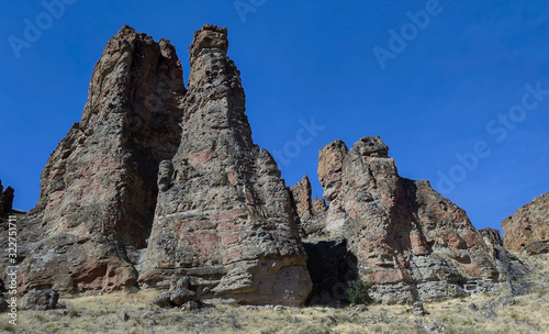 The amazing badlands and palisades of the John Day Fossil Beds clarno unit and rock formations in a semi desert landscape in Oregon State