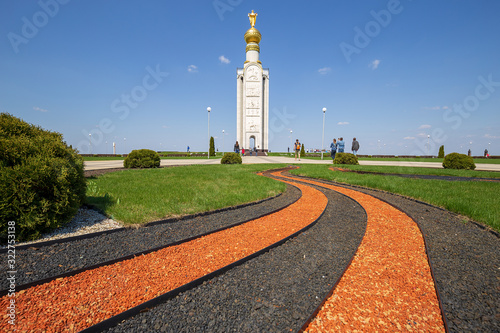 Prokhorovka, Russia. Design of the flowerbed in the form of St. George's ribbon before the bell-tower in Prokhorovka, Kursk Salient. Monuments of second world war. Tank battle. photo