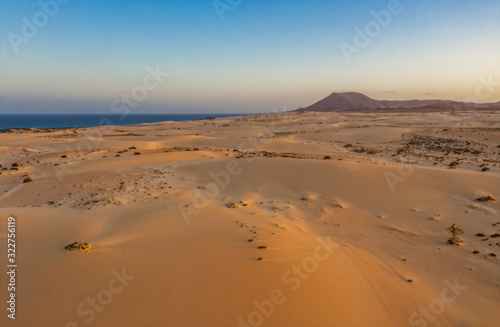 High angle view of road going through Corralejo dunes nature park in Fuerteventura. Aerial drone shot in october 2019