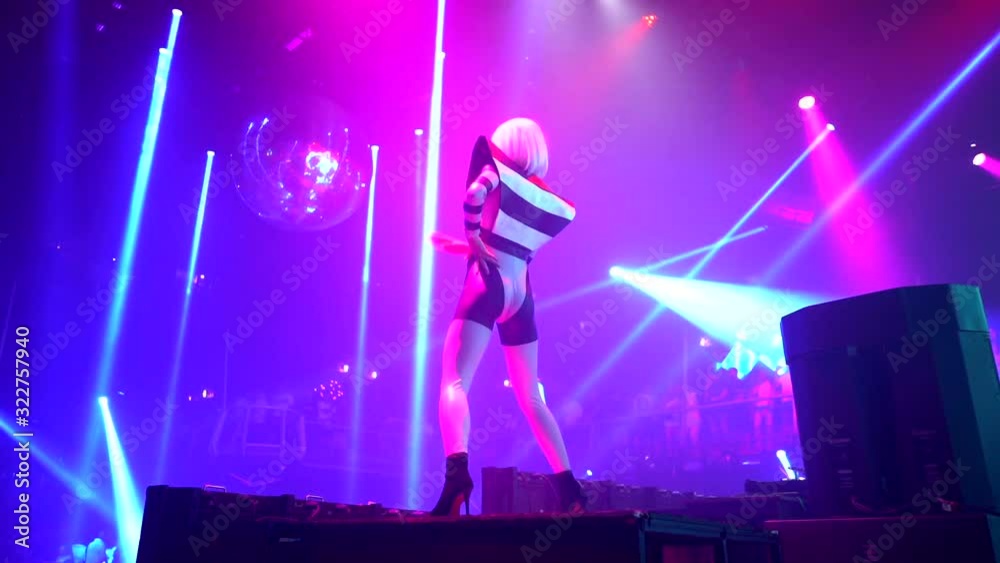 Gogo dancer dance in night club with blue light and move booty left to right in slow motion. Gogo dancer dance in night club with blue light and move booty left to right in slow motion.