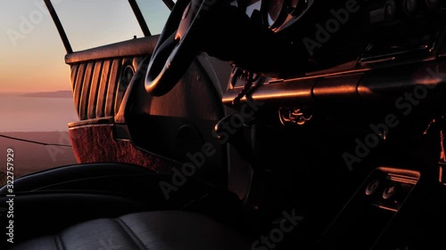 sunset reflecting off interior of old porsche photo