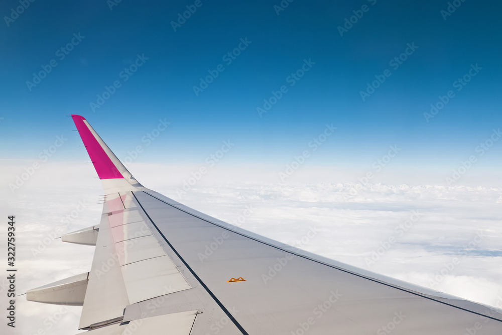 Fototapeta premium View from airplane window with blue sky